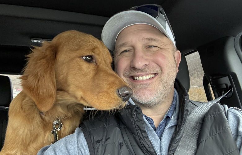 In this Feb. 2025 photo provided by Pam Palko, shown is Joe Palko after he was reunited with his six-month-old Golden retriever pup named Freddy, a week after the dog ran off from his home at the base of Sharp Mountain in Pottsville, Pa. (Joe Palko via AP) PAMR201 PAMR201