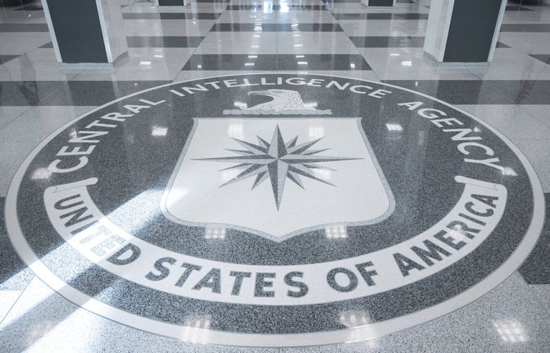 The seal of Central Intelligence Agency is seen in the lobby the headquarters building in Langley, Va., on Saturday, Sept. 24, 2022. (AP Photo/Kevin Wolf)