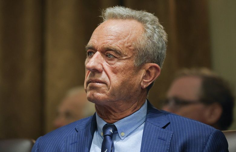 Health and Human Services Secretary Robert F. Kennedy Jr. listens as President Donald Trump holds a Cabinet meeting at the White House in Washington, Wednesday, Feb. 26, 2025. (Pool via AP) WX610 WX610