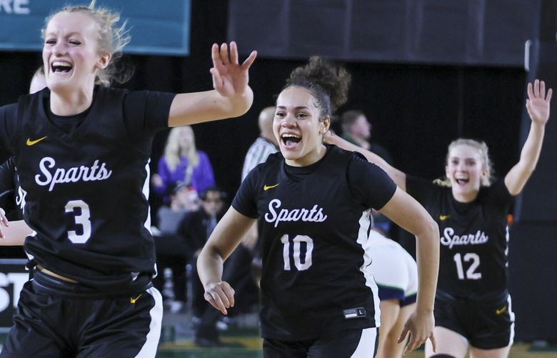 Sumner High celebrates their win over Woodinville High School to advance Friday night during the Class 4A semifinals Washington State Basketball Tournament in Tacoma, Washington, on March 7, 2025. 229453