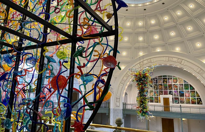 A view of the cavernous interior of Union Station from the second floor railing. Glass sculptures from Dale Chihuly hang around inside the dome.