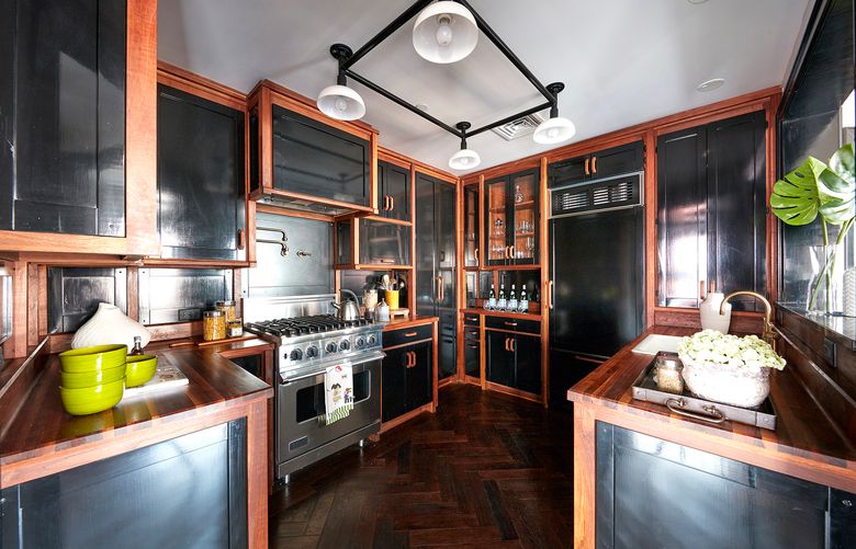 Wood elements add a sense of warmth and interest in this kitchen. (Scott Gabriel Morris/TNS)