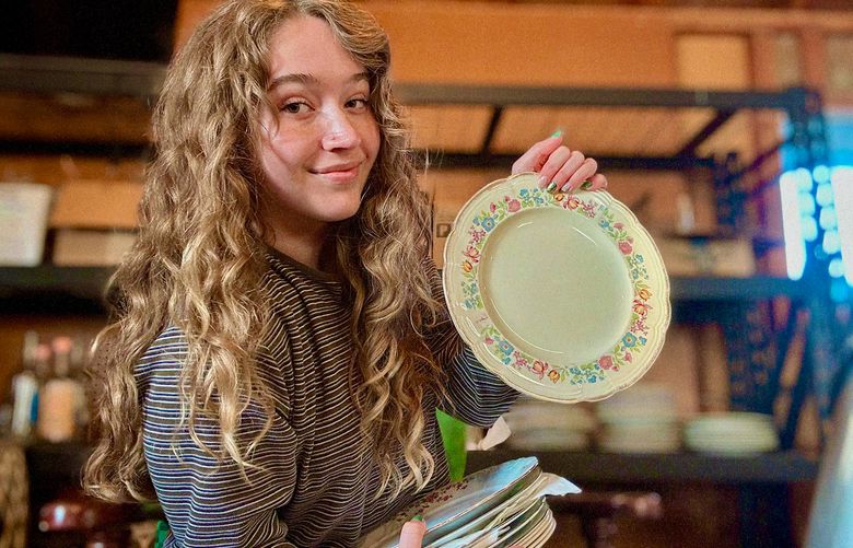 Tarryn Pitt with some of the thrift store plates she found for her wedding dinner in Oregon. She made sure that all of the plates were free of lead after buying them for $1 to $3 each. (Courtesy of Tarryn Pitt)