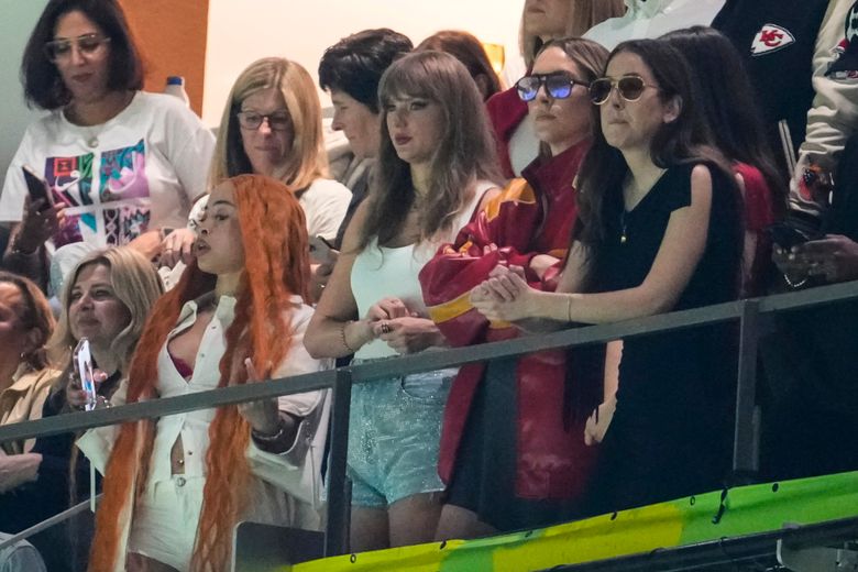 Ice Spice, from left, Taylor Swift, Este Haim and Alana Haim watch during the first half of the NFL Super Bowl between the Kansas City Chiefs and the Philadelphia Eagles on Sunday in New Orleans. (Gerald Herbert / The Associated Press)