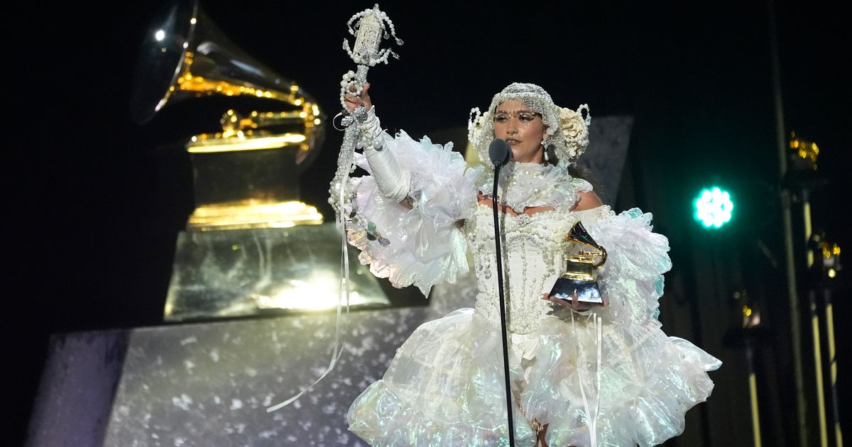 Smatterings of sparkle and color pop amid more subdued tones on Grammys red carpet