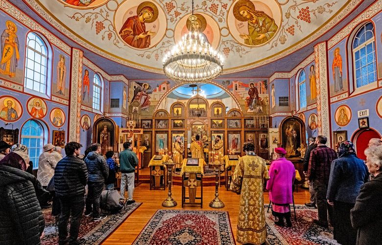 The Sunday liturgy is conducted in both English and Russian. The square sanctuary is elaborately decorated with icons and paintings of religious figures and events. (Jean Sherrard)