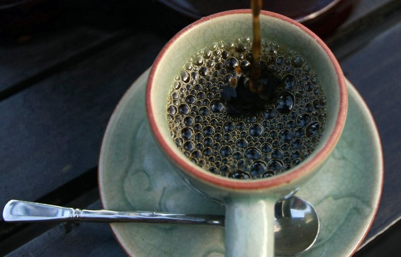 In this photo taken Dec. 3, 2012, the $1,100 per kilogram ($500 per pound) Black Ivory coffee is poured into a cup at a hotel restaurant in Chiang Rai province, northern Thailand. A Canadian entrepreneur with a background in civet coffee has teamed up with a herd of 20 elephants, gourmet roasters and one of the country’s top hotels to produce the Black Ivory, a new blend from the hills of northern Thailand and the excrement of elephants which ranks among the world’s most expensive cups of coffee. (AP Photo/Apichart Weerawong)