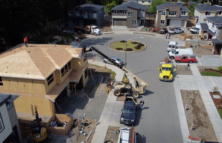 Terrene Homes has 14 houses in different stages of construction seen from the air Monday, May 10, 2021 in a Kirkland cul-de-sac. Wade Metz, a partner at the development company, says wood-based products have increased in cost. Meanwhile, homebuyers are willing to pay more. 217083