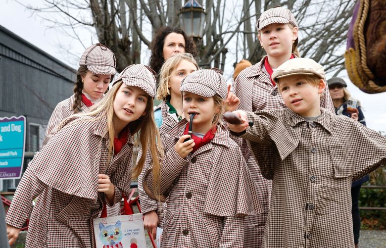 The Teeny Detectives from Seattle ask pirates Voldar Hoarabull played by Matt Hoar, left, and Blacky Beardsley, right, played by Bexar O’Riley, about their knives during the Mystery Weekend in Langley on Whidbey Island on Saturday, February 22, 2025. From left to right: bottom row: Ellerie Lampe, 10; Elijah Carlile, 6; Julius Hanseroth, 8. Back row: Sawyer Lampe,13, Evangeline Carlile, 10, Josephine Hanseroth, 12.

Amateur sleuths try and solve a murder mystery using a printed program with suspect photos, a clue map, copy of the Langley Gazette, and story synopsis. Over 40 live characters, dressed in period clothing, roam around the town offering clues, or perhaps lies. Stores throughout the downtown have have printed clue cards to help. This year’s Mystery Weekend will be February 22-23, and the theme is “Murder in a Small Town.”
