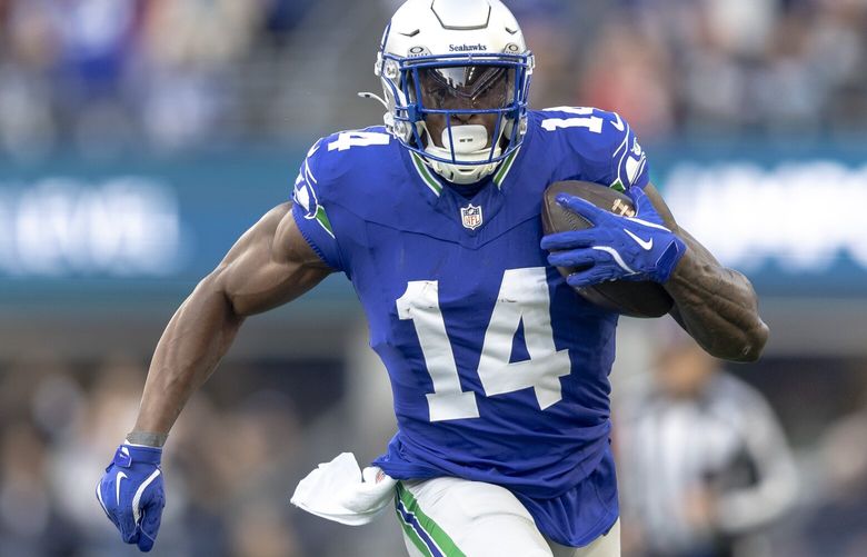 Seattle Seahawks wide receiver DK Metcalf (14) runs with the ball dduring an NFL football game against the San Francisco 49ers at Lumen Field on Thursday, Oct. 10, 2024, in Seattle.