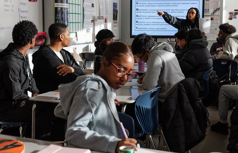 Teacher Ann Pyram leads a seminar on planning for college and careers at KIPP Academy Lynn Collegiate in Lynn, Mass. Nov. 20, 2024. The idea that every student should aim for a four-year college motivated a bipartisan movement for decades but now even enthusiastic promoters of the idea are reconsidering it. (Sophie Park/The New York Times)