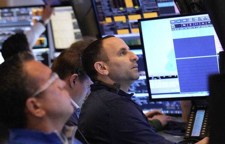 People work on the floor at the New York Stock Exchange in New York, Tuesday, March 4, 2025. NYSW108