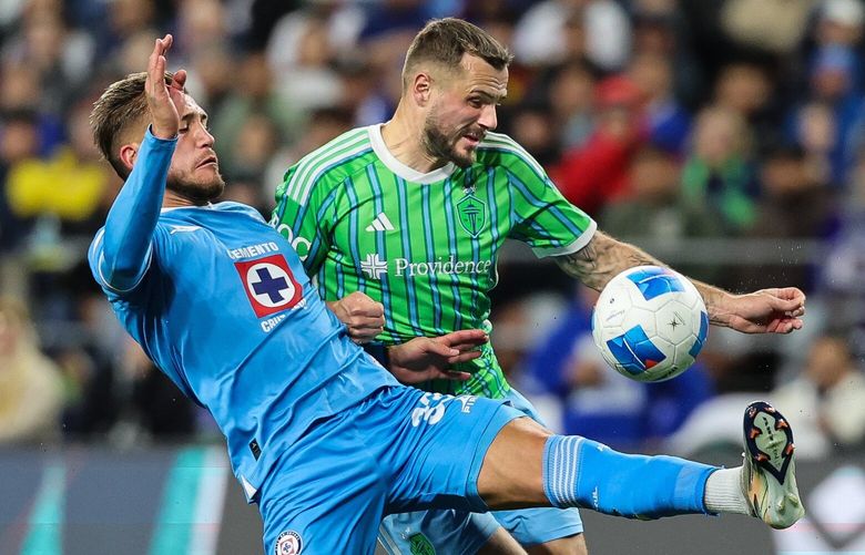 Cruz Azul defender Gonzalo Piovi denies Seattle’s Jordan Morris a shot on goal in the second half.  Cruz Azul of Mexico City played the Seattle Sounders FC in the second round of the CONCACAF Champions Cup Wednesday, March 5, 2025 at Lumen Field, in Seattle, WA. 229493