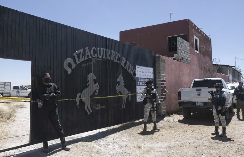 Police stand guard outside the entrance to Izaguirre Ranch where skeletal remains were discovered in Teuchitlan, Jalisco state, Mexico, Thusday, March 13, 2025. (AP Photo/Alejandra Leyva) MXEV101 MXEV101