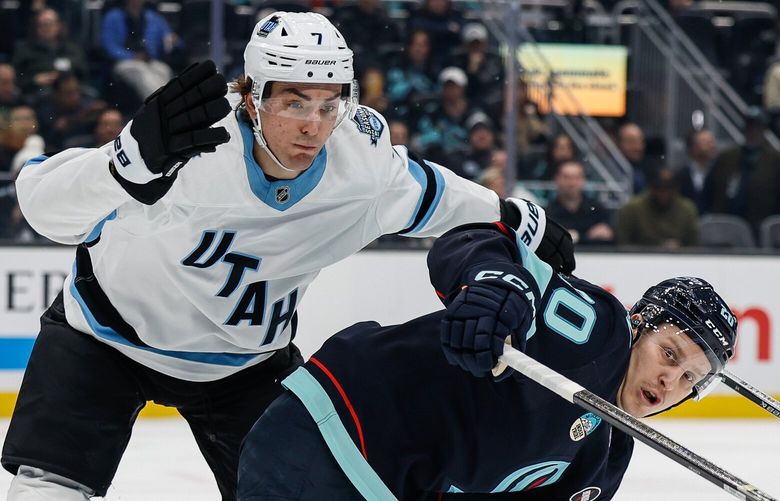 Utah defensiveman Michael Kesselring takes Seattle’s Eeli Tolvanen out of the attack in the first period. The Utah Hockey Club played the Seattle Kraken in NHL Hockey Friday, March 14, 2025 at Climate Pledge Arena, in Seattle, WA. 229461