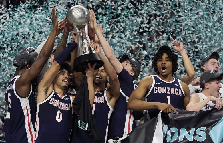 Gonzaga players celebrate after defeating Saint Mary’s in an NCAA college basketball championship game in the West Coast Conference men’s tournament Tuesday, March 11, 2025, in Las Vegas. (AP Photo/John Locher) NVJL143 NVJL143