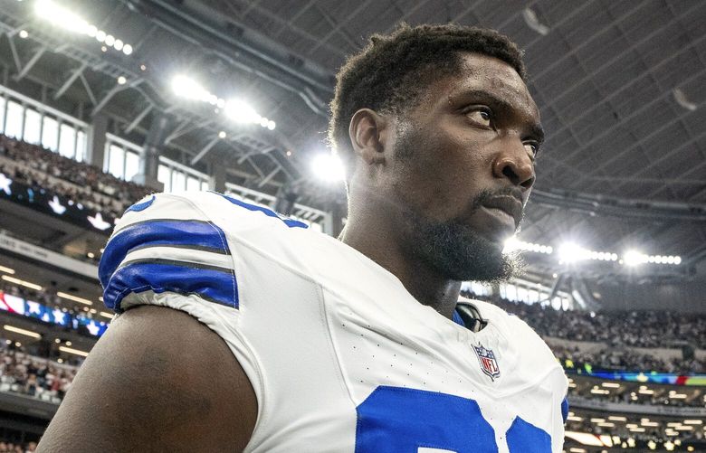 Dallas Cowboys defensive end DeMarcus Lawrence stands for the national anthem before a football game against the New Orleans Saints Sunday, Sept. 15, 2024, in Arlington, Texas.