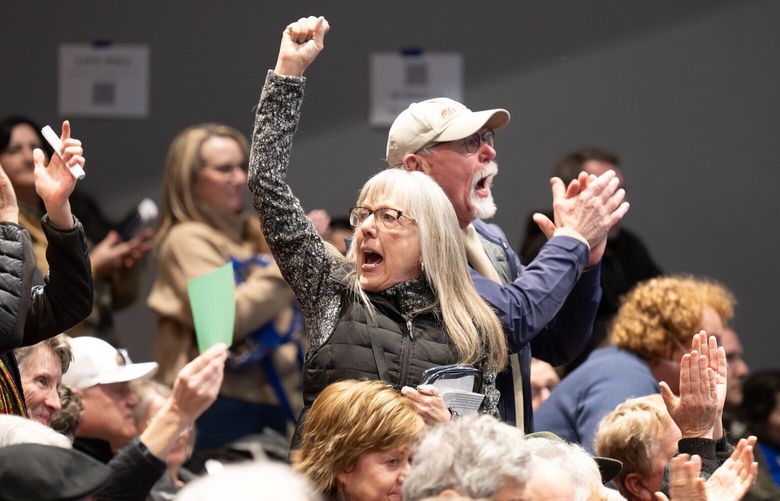 Many people stood in opposition to how U.S. Rep. Michael Baumgartner answered questions during a town hall meeting with his constituents in Washington’s 5th Congressional District, Monday, March 17, 2025, at Whitworth University’s Cowles Auditorium. The event was hosted by Whitworth’s Democracy & Discourse Committee.