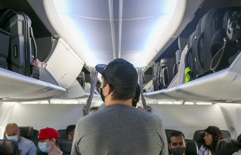 People board a Boeing 737 MAX plane operated by Air Canada at Edmonton International Airport in Alberta, Canada, on Wednesday, July 27, 2022.