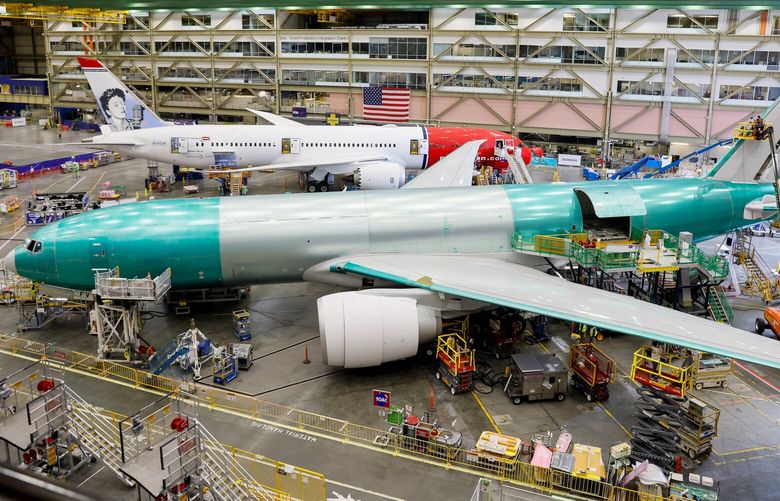 **Image is embargoed to Sat., July 20, at 12:01 GMT, Fri., July 19 at 8:01 p.m. ET and 5:01 p.m. PT**

A 787-9 and a 777 share a bay at the Boeing Everett Production Facility Wednesday, June 26, 2024 in Everett, WA. 227341