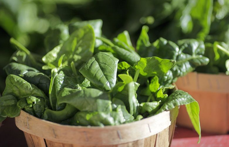 In this photo taken Jan. 2, 2016, baskets of organic spinach and other leafy greens are displayed for sale at a farmers market in Falls Church, Va. The Obama administration’s latest dietary guidelines, released Thursday, Jan. 7, 2016, to help Americans reduce their likelihood of disease and obesity through a more healthful diet. The main message hasn’t changed much over time: Eat your fruits and vegetables, whole grains and seafood, and keep sugar, fats and salt in moderation.  (AP Photo/J. Scott Applewhite)
