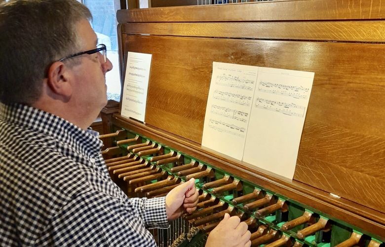 John Widmann plays a carillon in Lier, Belgium, during a recent visit. MUST CREDIT: Koen van Assche