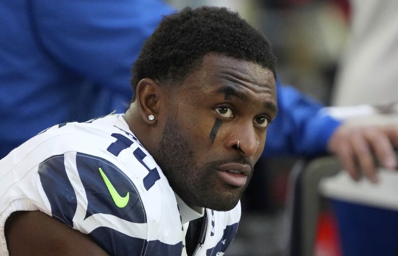 Seattle Seahawks wide receiver DK Metcalf (14) warms up before an NFL football game against the Arizona Cardinals, Sunday, Dec. 8, 2024, in Glendale, Ariz. (AP Photo/Rick Scuteri)