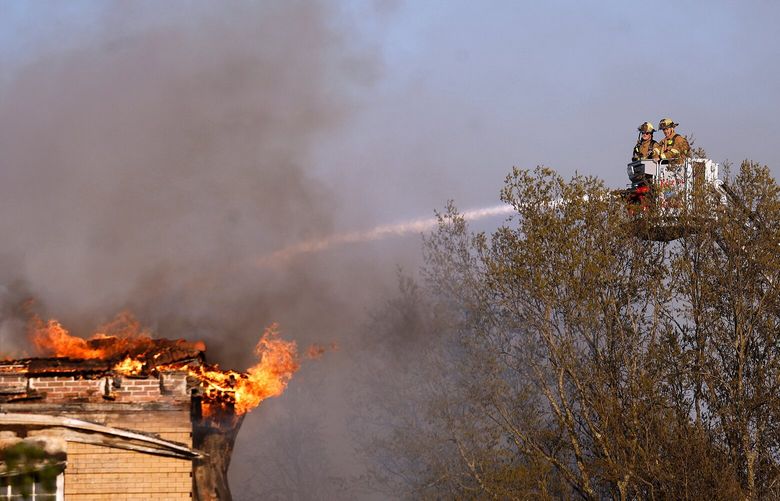 North Little Rock and Maumelle firefighters battle a fire at the St. Joseph Center of Arkansas on Wednesday, March 19, 2025, in North Little Rock, Ark. (Thomas Metthe/Arkansas Democrat-Gazette via AP) ARLID101 ARLID101