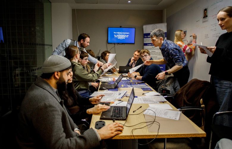 A dozen people gathered in a conference room in London on Feb. 20, 2025, for an immersive production called Jury Games, scrutinizing evidence and deliberating to reach a verdict in an arson-murder case. Immersive theater productions are taking jury service, which most consider a burden to be avoided at all costs, and packaging it as entertainment. (Sam Bush/The New York Times) XNYT0435 XNYT0435