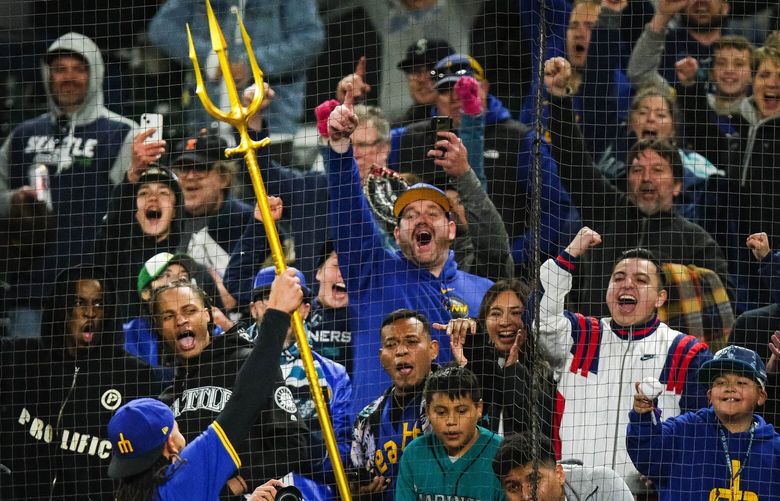 J.P. Crawford raises the trident for fans after the postgame interview Friday.  The Boston Red Sox played the Seattle Mariners in Major League Baseball Friday, March 29, 2024 at T-Mobile Park, in Seattle, WA. 226517