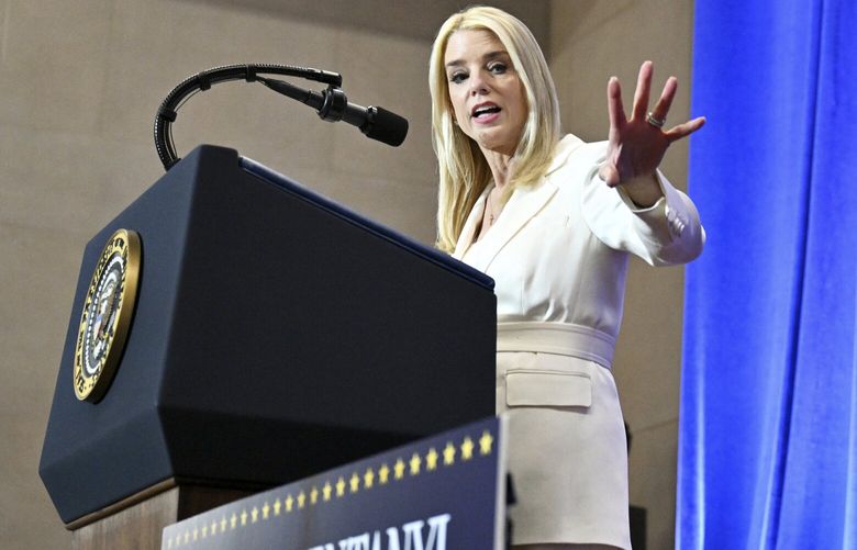 Attorney General Pam Bondi speaks before President Donald Trump at the Justice Department in Washington, Friday, March 14, 2025. (Pool via AP) WX606 WX606