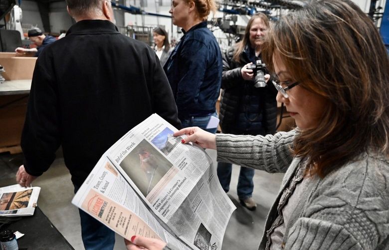 Publisher Kari Mar holds the first print edition of the La Conner Community News last week at Skagit Publishing.