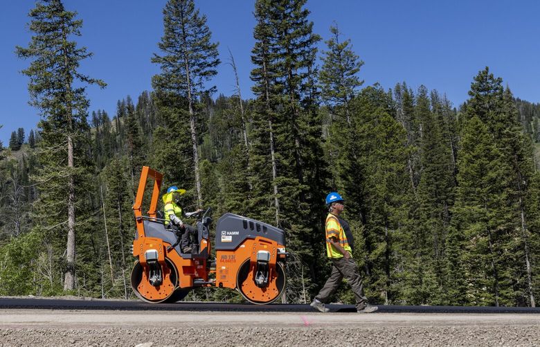 FILE – Construction takes place on the Teton Pass on June 25, 2024 near Jackson, Wyo. (AP Photo/Natalie Behring, File) CLI605 CLI605