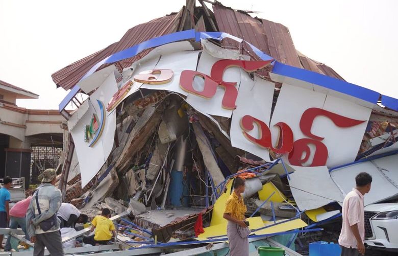 People look over a damaged building after a 7.9-magnitude earthquake struck in Nay Pyi Taw, Myanmar, on March 28, 2025.  (Myo Kyaw Soe/Xinhua via ZUMA Press/TNS) 138485189W 138485189W