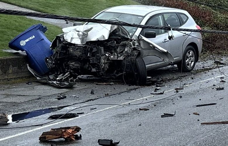 A car crashed into and downed two power poles Thursday evening on March 27, 2025, in Bothell, Wash.