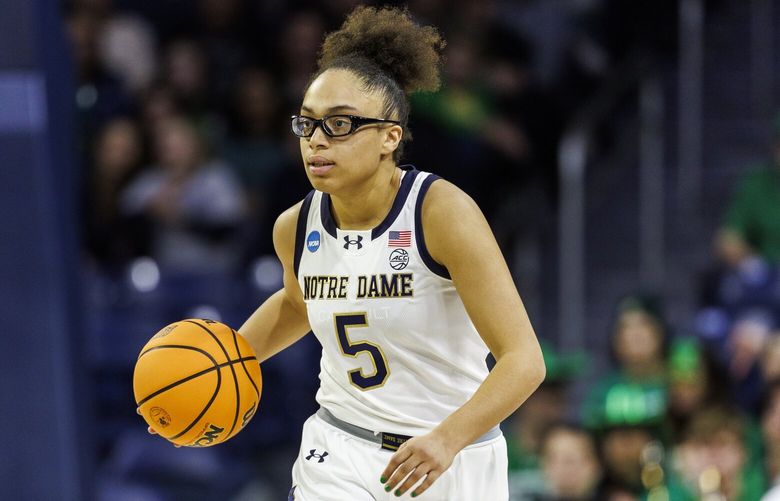 Notre Dame guard Olivia Miles (5) advances the ball during the second half in the first round of the NCAA college basketball tournament against Stephen F. Austin, Friday, March 21, 2025, in South Bend, Ind. (AP Photo/John Mersits)
