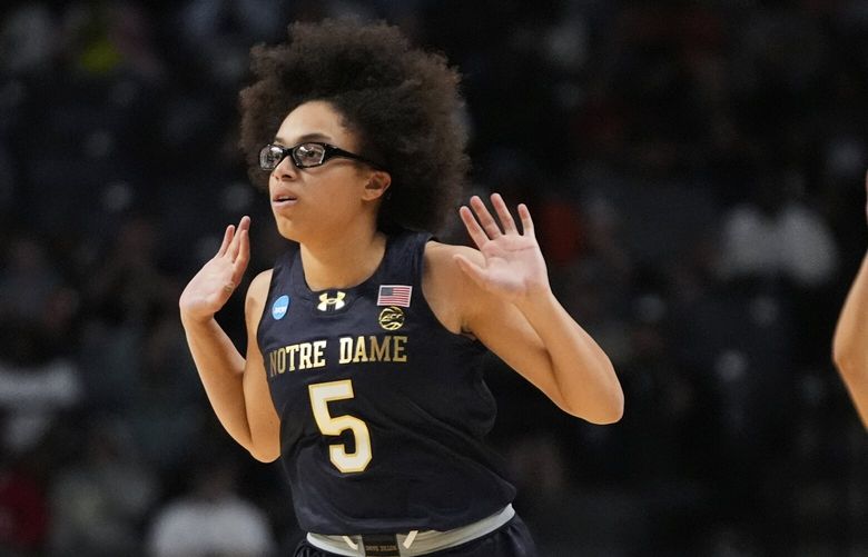 Notre Dame guard Olivia Miles (5) reacts after making a 3-point basket against TCU during the first half in the Sweet 16 of the NCAA college basketball tournament, Saturday, March 29, 2025. in Birmingham, Ala. (AP Photo/Gerald Herbert) ALGH122 ALGH122
