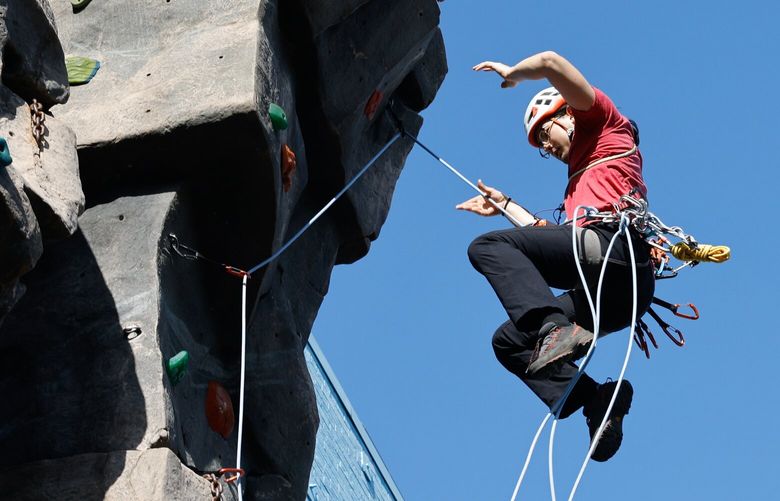 Jonathan Tinker from Kenmore practices lead rope soloing techniques, including falling, on the climbing wall at the Mountaineers Seattle Program Center in Seattle on Saturday, March 29, 2025. Tinker has been climbing for four or five years. “I really jumped into it,” he says of his experiences learning from friends and on his own.