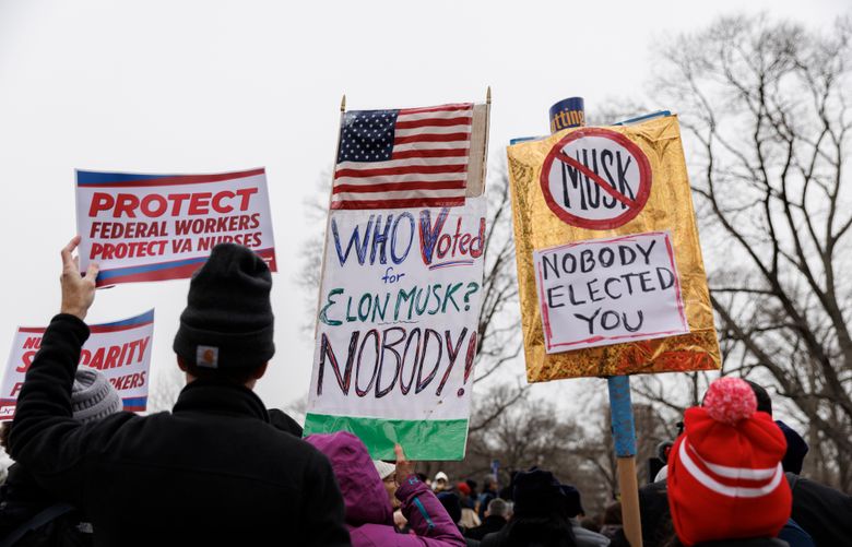 Federal workers rally near the Capitol on Feb. 11, urging Congress to protect civil service jobs from political interference by the Trump administration. MUST CREDIT: Moriah Ratner/For The Washington Post
