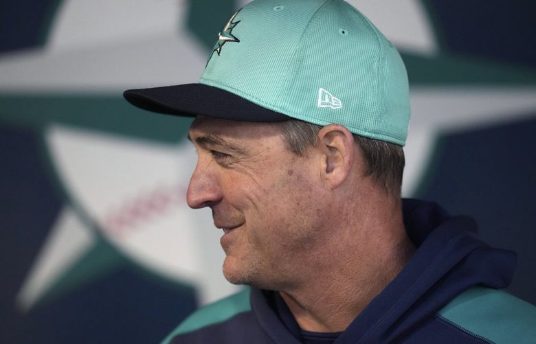 Seattle Mariners manager Dan Wilson pauses in the dugout prior to a spring training baseball game against the Los Angeles Dodgers Friday, March 7, 2025, in Peoria, Ariz. (AP Photo/Ross D. Franklin) RFOTK201 RFOTK201