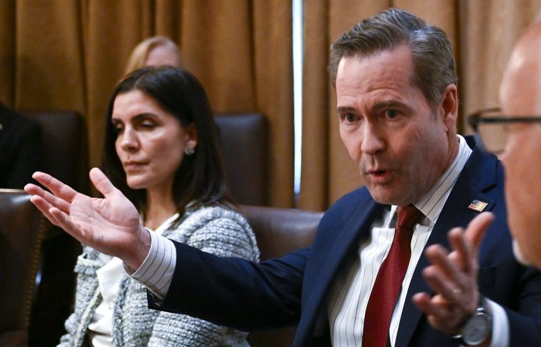 National security adviser Michael Waltz, center, explains how a reporter ended up on a group Signal chat among top officials discussing a U.S. air attack on Yemen’s Houthis.