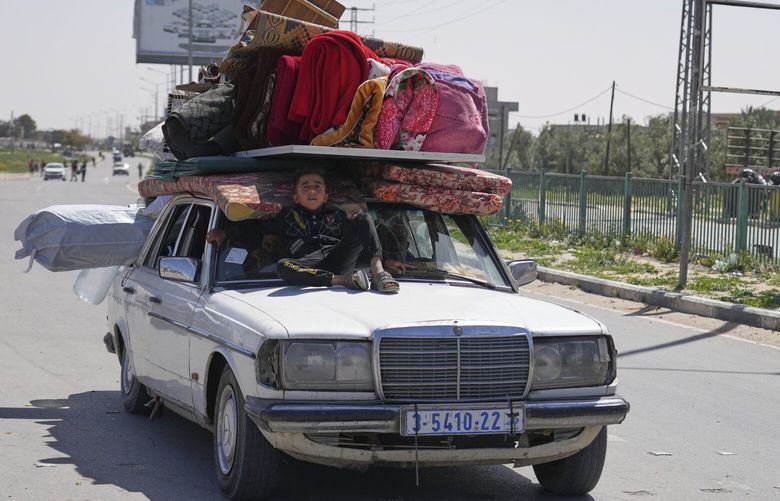 FILE – Palestinians who fled Rafah after Israeli evacuation orders, arrive in Khan Younis, Gaza, on Monday, March 31, 2025. (AP Photo/Abdel Kareem Hana, File) NYRL222 NYRL222