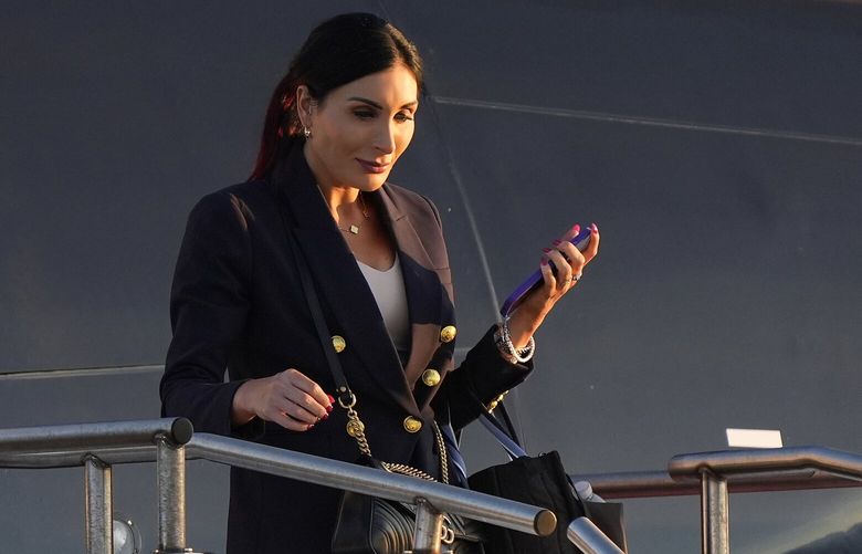 FILE – Laura Loomer arrives with Republican presidential nominee former President Donald Trump at Philadelphia International Airport, Sept. 10, 2024, in Philadelphia. (AP Photo/Chris Szagola, File) WX501 WX501