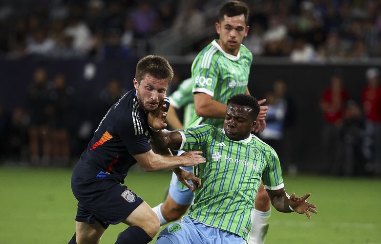 San Diego FC midfielder Anders Dreyer, left, and Seattle Sounders defender Nouhou Tolo collide during their MLS soccer match on Saturday, April 5, 2025 in San Diego, CA. (Meg McLaughlin /The San Diego Union-Tribune via AP) CADIU102 CADIU102