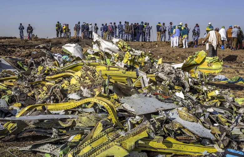 FILE – In this March 11, 2019, file photo, wreckage is piled at the crash scene of an Ethiopian Airlines flight crash near Bishoftu, Ethiopia. A published report says pilots of an Ethiopian airliner that crashed followed Boeingâ€™s emergency steps for dealing with a sudden nose-down turn but couldnâ€™t regain control. (AP Photo/Mulugeta Ayene, File) NYAG303