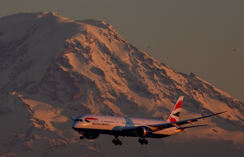 A British Airways Boeing 787-10 Dreamliner aircraft comes in for a landing in front of Mt. Rainier at Sea-Tac Airport Sunday, Jan. 26, 2025. 229135