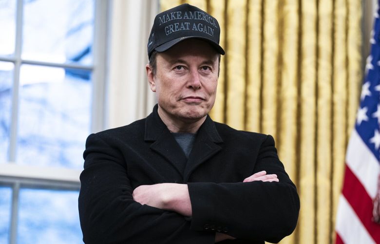 Elon Musk speaks with President Donald Trump and reporters in the Oval Office on Feb. 11. MUST CREDIT: Jabin Botsford/The Washington Post
