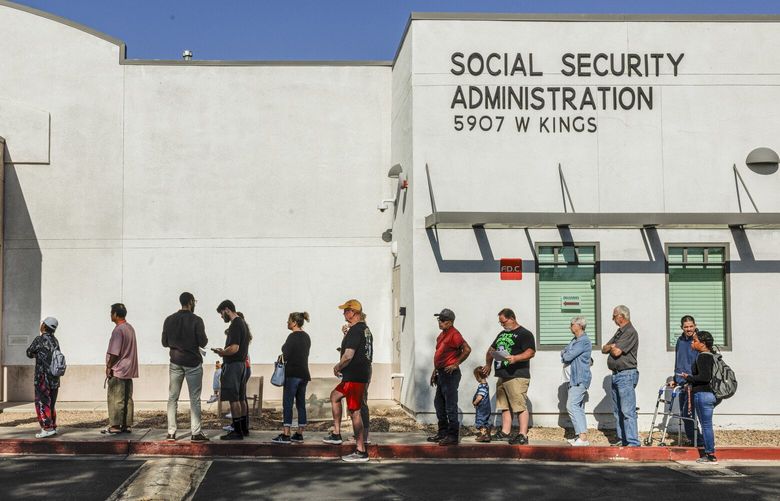 People wait outside a Social Security Administration office before it opened for the day in Glendale, Ariz., on Tuesday, April 8, 2025. President Donald Trump promised not to touch Social Security, but as Elon Musk trims staff and cuts phone services, the system is groaning under the pressure. (Adriana Zehbrauskas/The New York Times) XNYT0026 XNYT0026