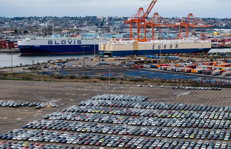 A Eukor Car Carriers Inc. and Hyundai Glovis ship behind new Hyundai vehicles at the Port of Tacoma in Tacoma, Washington, US, on Thursday, March 27, 2025. President Donald Trump signed a proclamation to implement a 25% tariff on auto imports, expanding a trade war designed to bring more manufacturing jobs to the US and setting the stage for an even broader push on levies next week. Photographer: David Ryder/Bloomberg