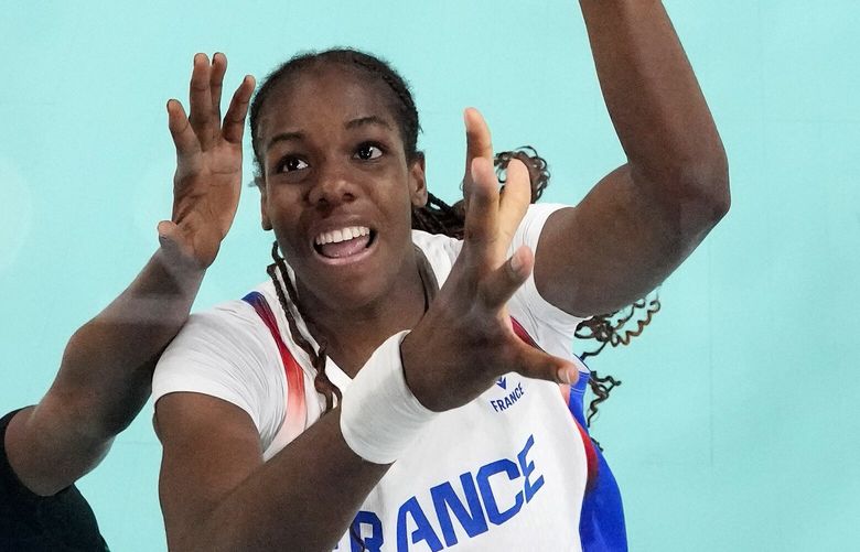 FILE – France’s Dominique Malonga, right, shoots as Nigeria’s Amy Elizabeth Balogun defends in a women’s basketball game at the 2024 Summer Olympics, Aug. 1, 2024, in Villeneuve-d’Ascq, France. (AP Photo/Michael Conroy, Pool File) XPAG342 XPAG342